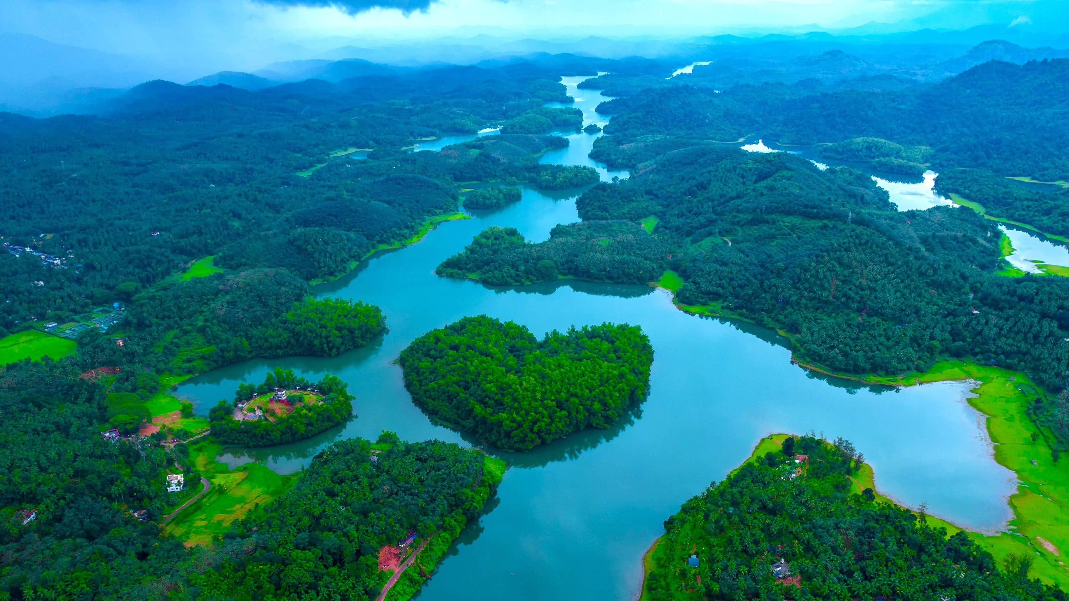 Kakkayam hills scenic view with mist and river near Kariyathumpara